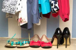 Different clothes on hangers close up