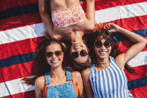 Friends lying down at the beach