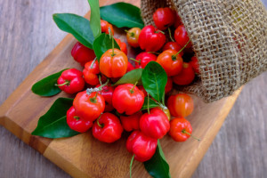 Acerola fruit close up on background.